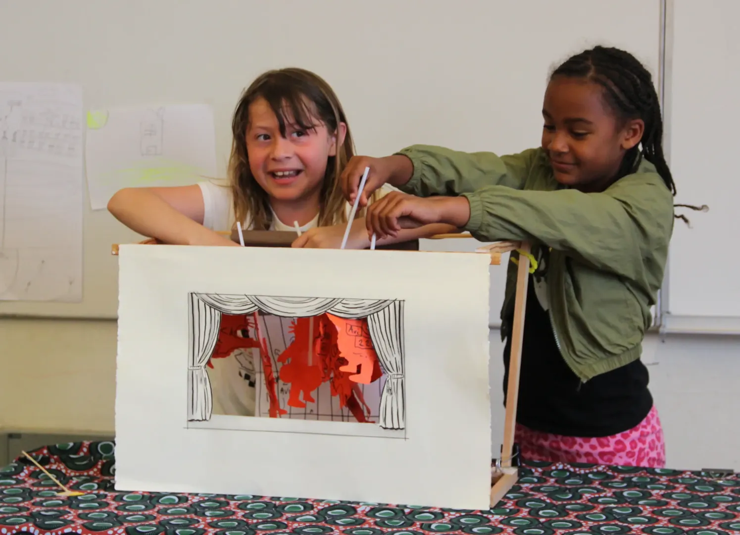 Children preforming puppet show