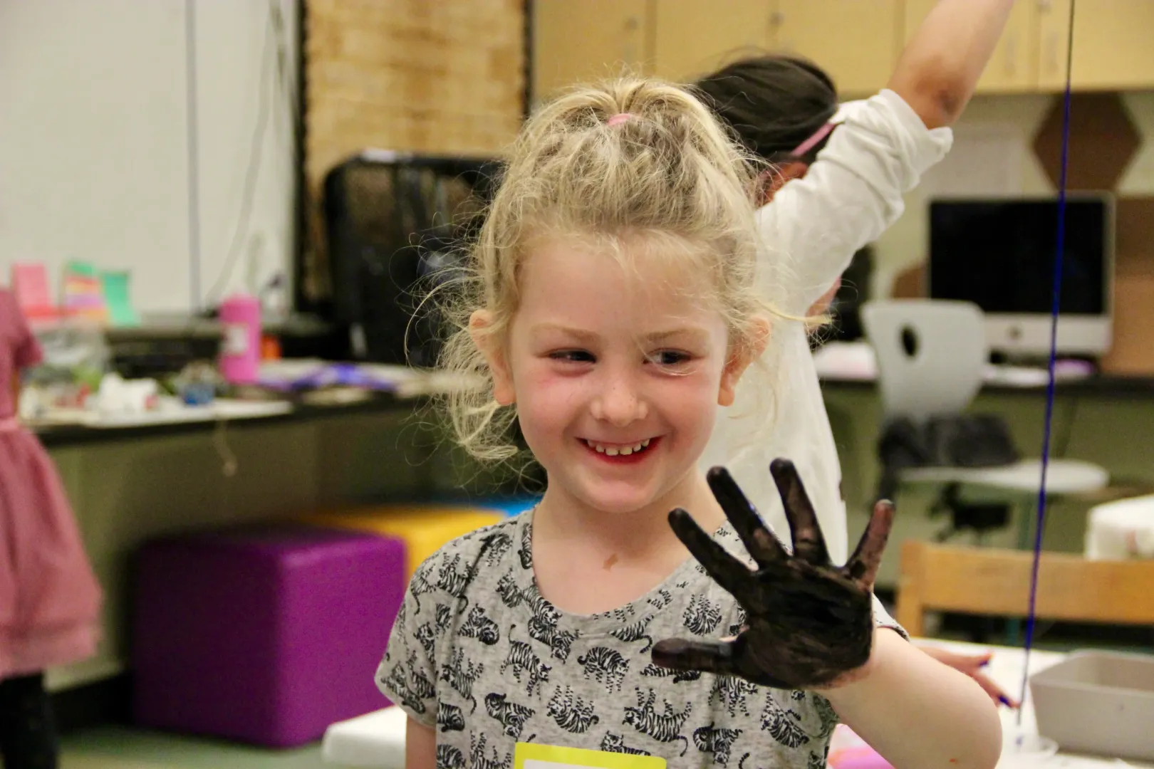 Smiling girl making art