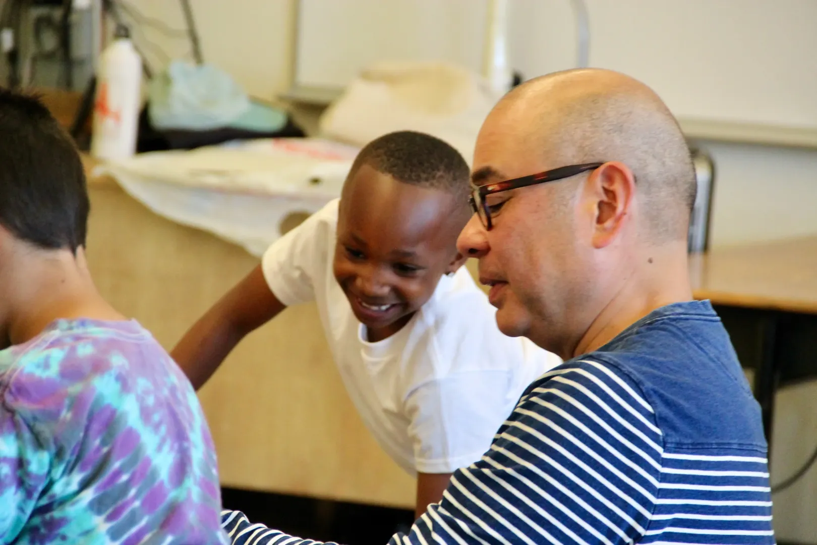 Teacher and student making art