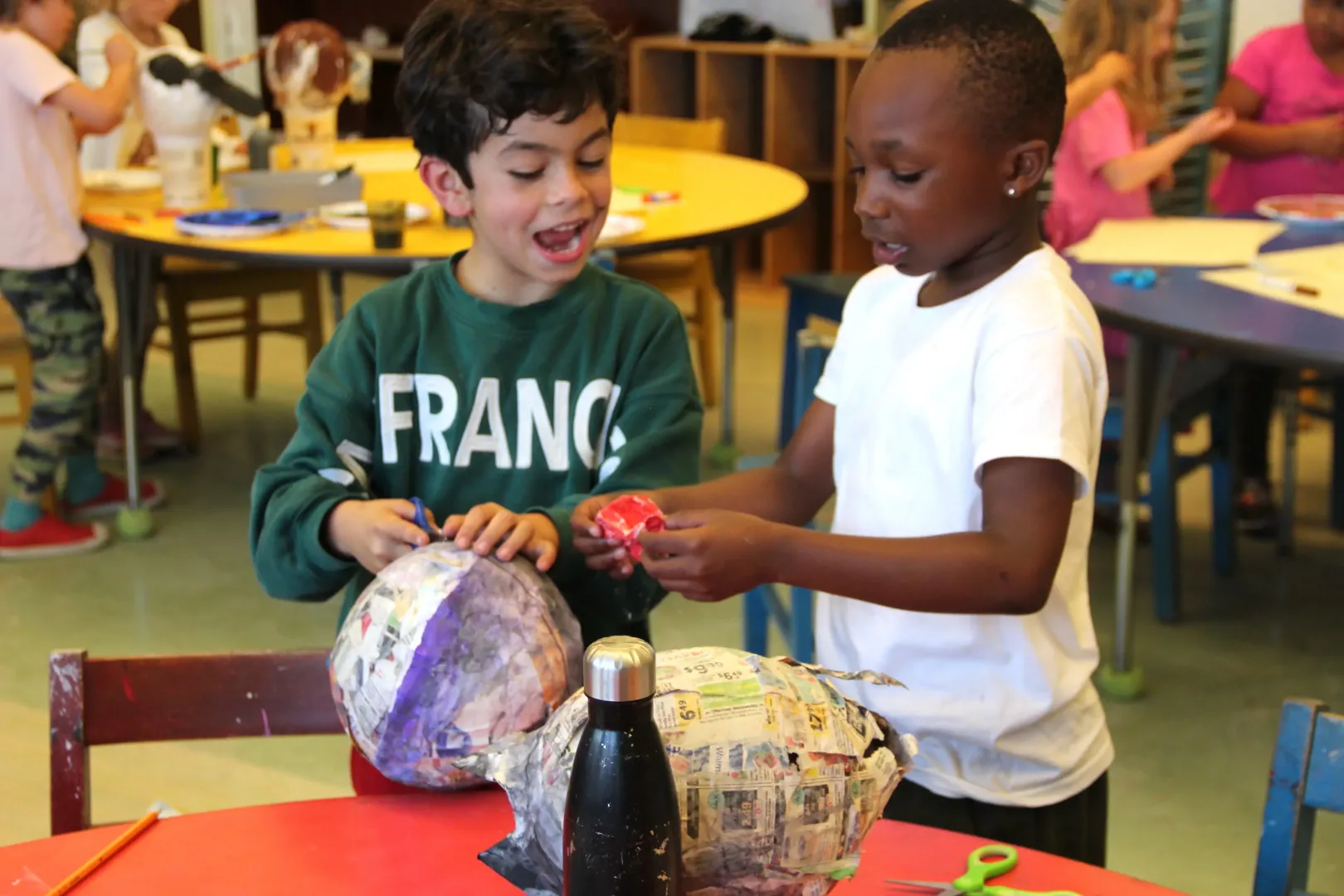 Two children making art