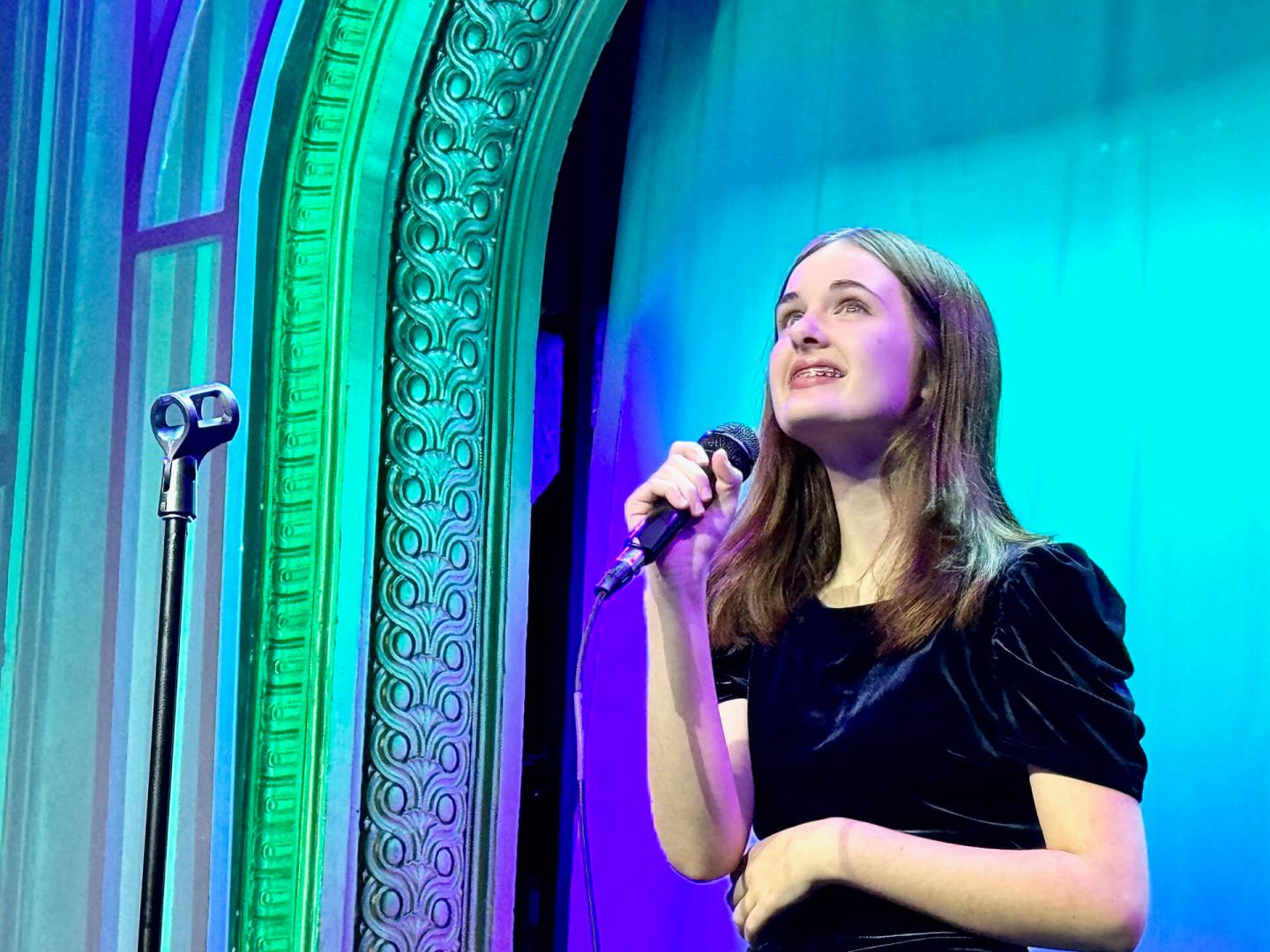 Girl singing on stage