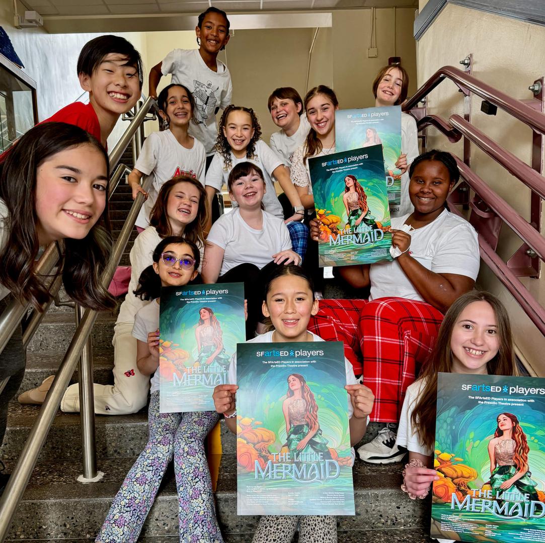 Children with posters from The Little Mermaid