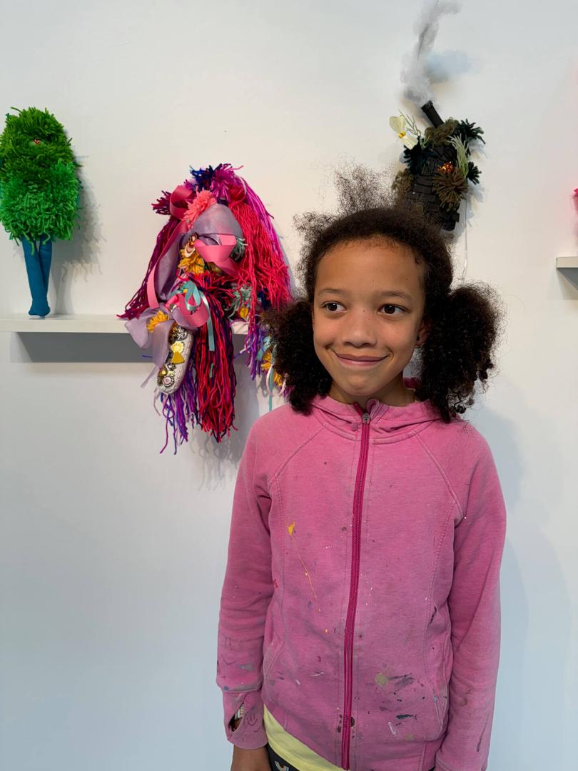 Child in front of artwork